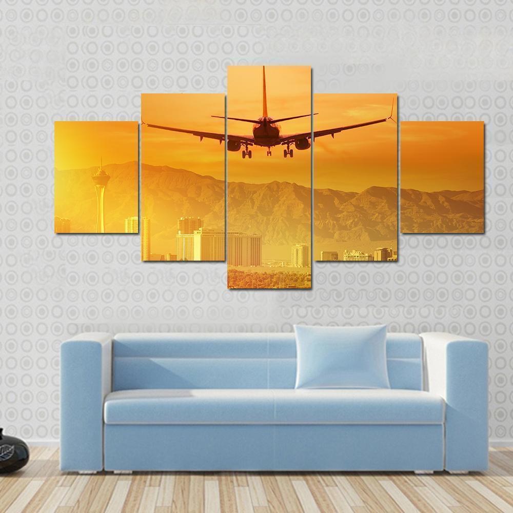 Airplane Flying Above City Airplane Canvas Wall Art
