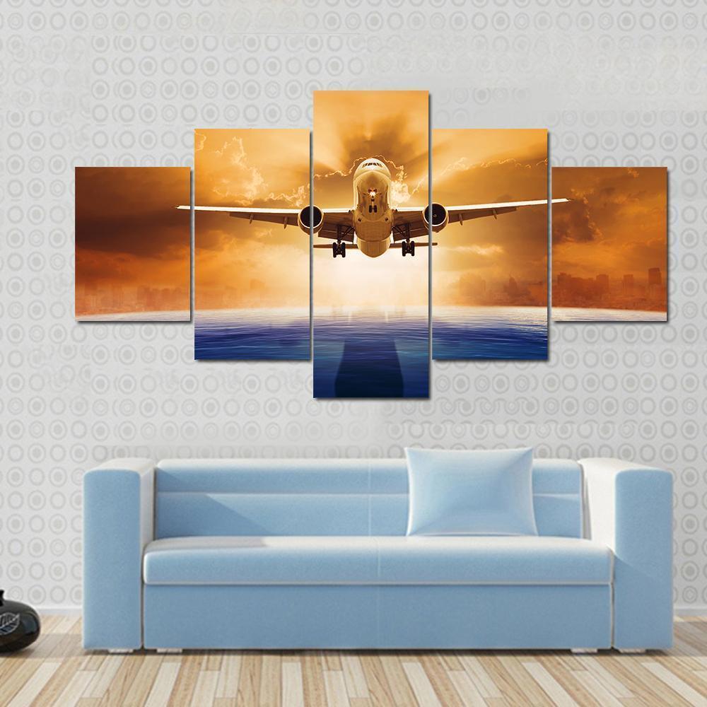 Airplane Flying Above Ocean Airplane Canvas Wall Art