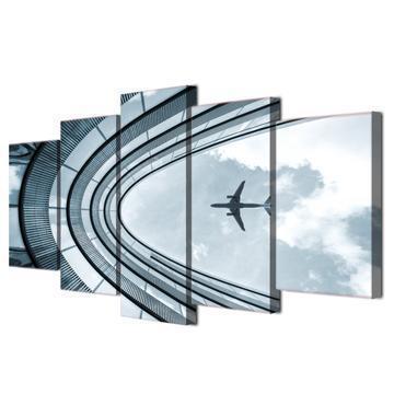 Airplane Flying Over Building Airplane Canvas Wall Art
