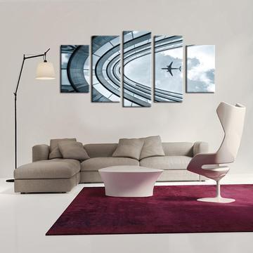 Flying Over Building Airplane Canvas Wall Art