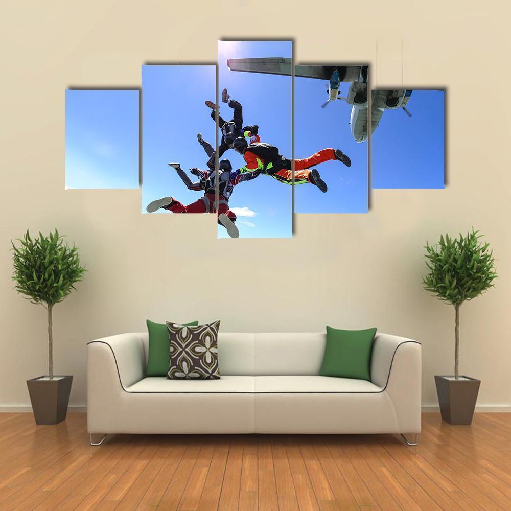 Four Parachutists Jumping Out Of An Airplane Sport Canvas Wall Art