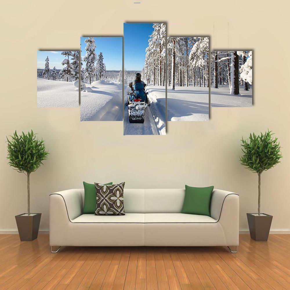 Man Traveling Finnish Lapland With Snowmobile Nature Canvas Wall Art