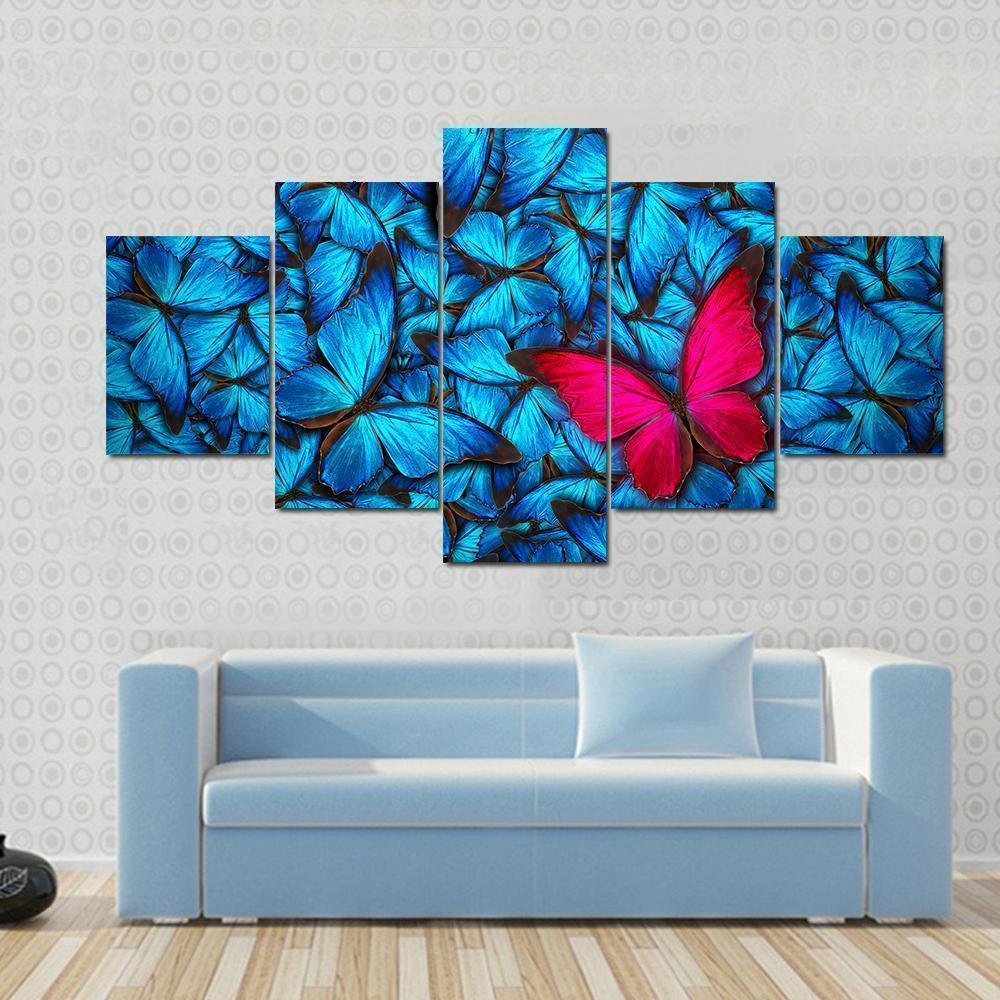 Pink Butterfly On Group Of Blue Butterfly Animal Canvas Wall Art